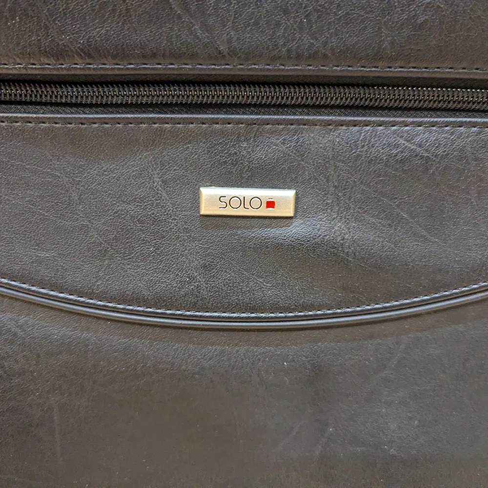 Solo brand black leather briefcase new never used. Missing shoulder strap.